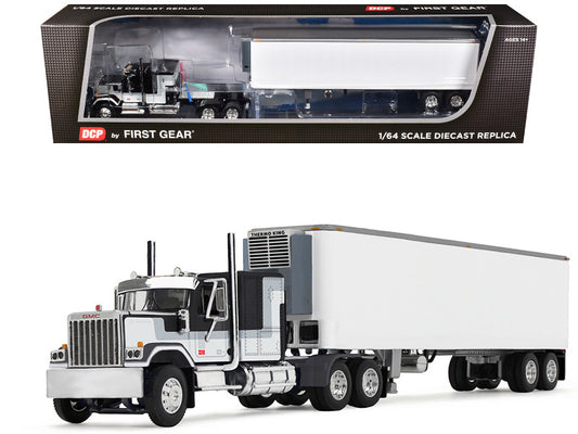 Model truck with trailer in front of its packaging box