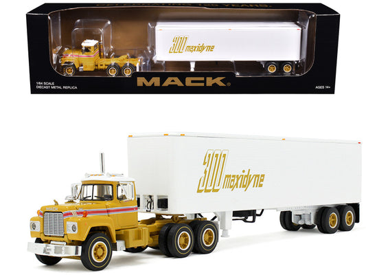 A 1/64 scale diecast model of a Mack R Model Day Cab with a trailer, in yellow with red stripes and white top, placed next to its black box packaging with the Mack logo.