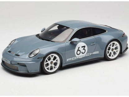 Model car of a Porsche with the number 63 on a white background