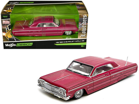 1964 Chevrolet Impala model car in red with packaging displaying 'Maisto Design' branding.