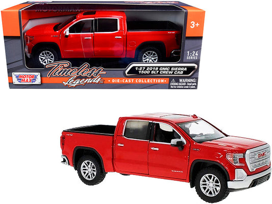 Red toy GMC Sierra truck in packaging with 'Motor Max' branding.