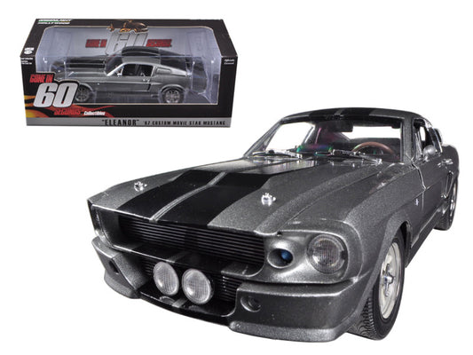 Model car of a classic black Ford Mustang with a clear box in the background