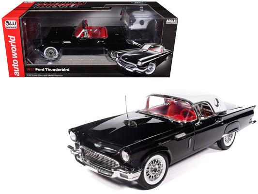 Black 1957 Ford Thunderbird model car with red interior in front of its packaging.