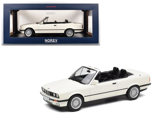 Model car of a BMW convertible in a Norev box on a white background