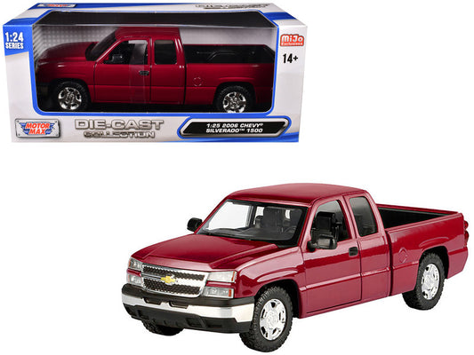 Red Chevrolet Silverado model truck in front of its packaging