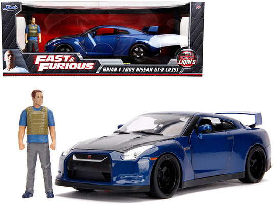 Blue toy car and figure from 'Fast & Furious' series in front of packaging