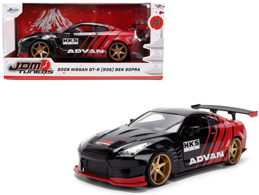Model car of a 2009 Nissan GT-R (R35) Ben Sopra with 'HKS' and 'Advan' branding on a white background.