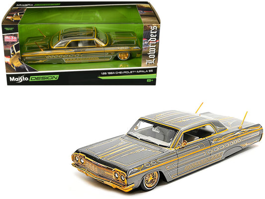 1962 Chevrolet Malibu model car with gold and black design, displayed with packaging.