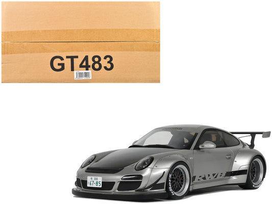 Model car with RWB badge next to a cardboard box labeled GT483 on a white background