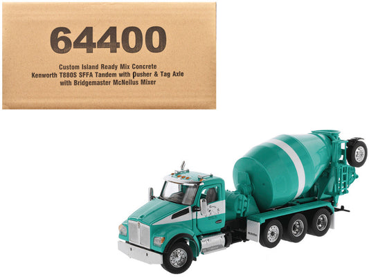 A 1/50 scale diecast model of a Kenworth T880S SFFA Tandem truck with a mixer, in green and white, with the product's box in the background.
