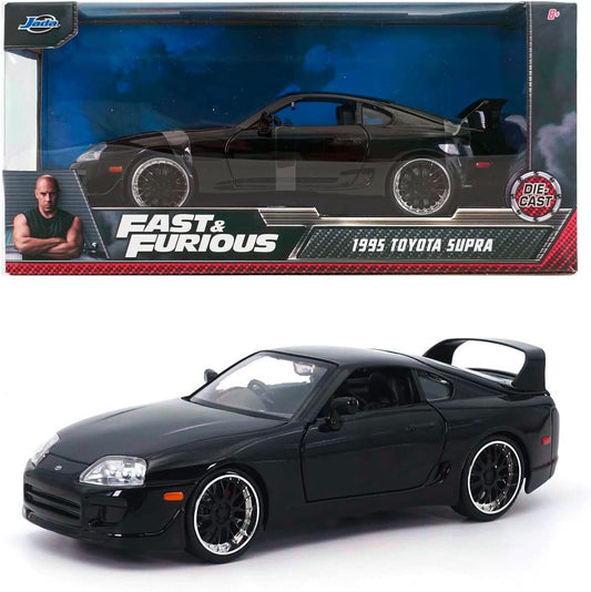 1995 Toyota Supra model car from Fast & Furious series in front of packaging