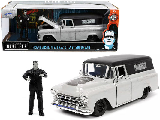 A 1:24 scale die cast metal model of a 1957 Chevrolet Suburban in gray and black with a 'Frankenstein' graphic on the side, accompanied by a figurine of Frankenstein's Monster.