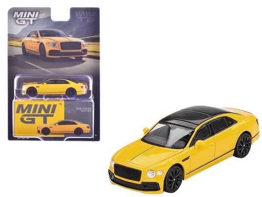 Yellow Bentley model car with packaging on a white background