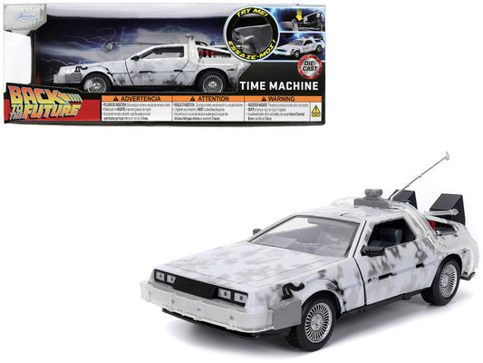 A 1/24 scale diecast model of the DMC DeLorean Time Machine from the 'Back to the Future' movie series, in brushed metal with lights, part of the Hollywood Rides series by Jada.