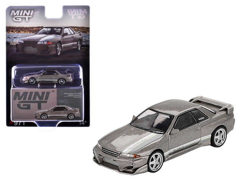 Silver die-cast car model with packaging displaying 'MINI GT' branding.