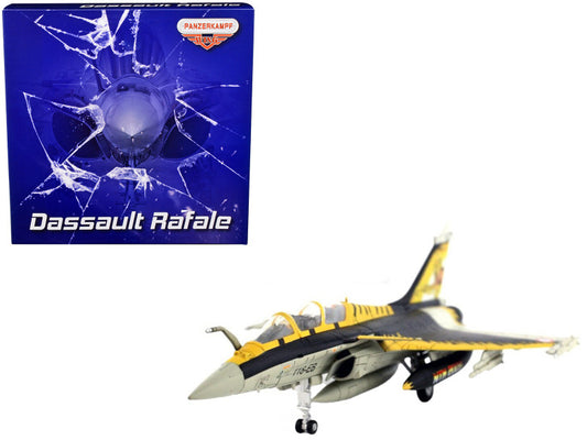 Model of a Dassault Rafale aircraft with a broken packaging box in the background