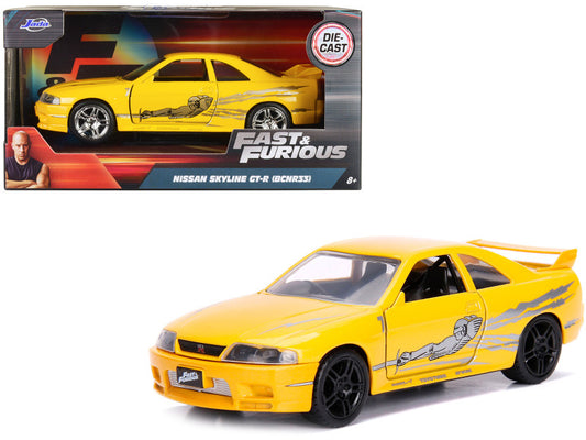 Yellow Nissan Skyline GT-R model car from 'Fast & Furious' series with packaging.