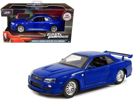 Blue toy car model of a Nissan Skyline GT-R R34 from 'Fast & Furious' series in packaging.