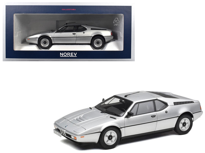 Model car of a sports car with Norev packaging on a white background