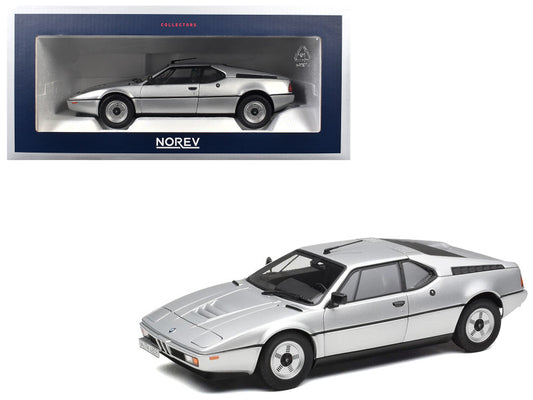 Model car of a sports car with Norev packaging on a white background