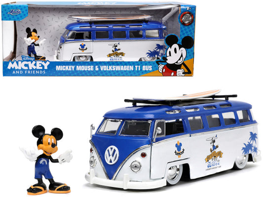 A 1/24 scale diecast model of a blue and white Volkswagen T1 Bus with graphics, accompanied by a Mickey Mouse diecast figure holding a surfboard.