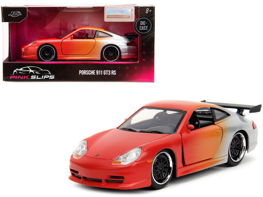 A diecast model of a Porsche 911 GT3 RS in orange and silver colors with black wheels, displayed in its packaging which is also shown.