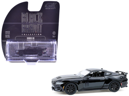 Black muscle car model with packaging on a white background