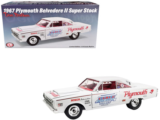 A 1/18 scale diecast model of a 1967 Plymouth Belvedere II Super Stock in white with graphics, and red interior. The model is in its original packaging and has realistic details such as real rubber tires and steerable wheels.