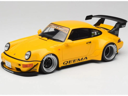 Yellow model car with black roof and 'QEEMA' branding on a white background