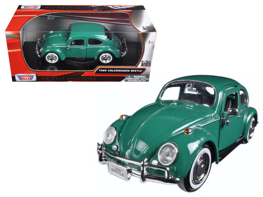 A 1/24 scale diecast model of a 1966 Volkswagen Beetle in green color, with the car displayed both inside and outside the box.