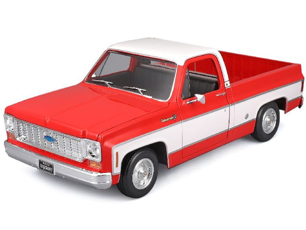 Model of a red and white truck on a white background