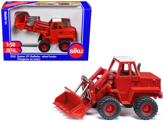 Red toy wheel loader with packaging displaying Siku branding on a white background