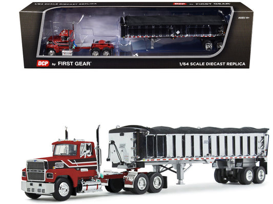 Model truck with trailer in front of its packaging box, featuring DCP by First Gear branding.