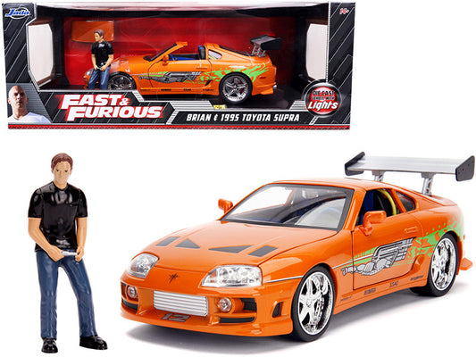 Model car and figure from 'Fast & Furious' series in front of packaging