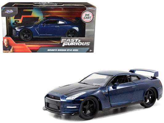 Blue toy car model of a Nissan GT-R from 'Fast & Furious' series in front of its packaging.
