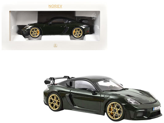 Model car of a sports car with gold wheels on a white background, featuring the Norev brand.
