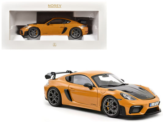 Orange sports car model with black roof in front of a white box displaying the same car, on a white background.