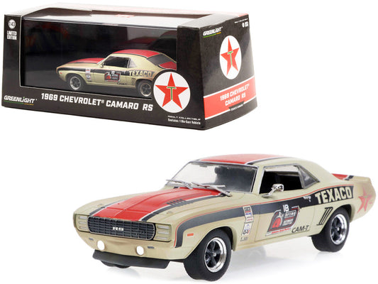 A 1969 Chevrolet Camaro RS diecast model car in beige, red, and black colors with racing decals, displayed in front of its packaging box.