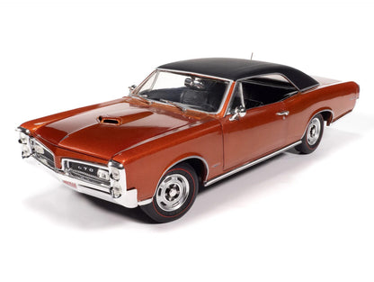 Model of a classic car with a brown body and black roof on a white background