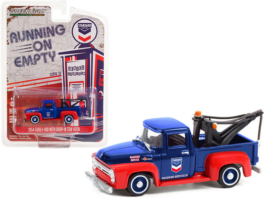 A diecast model of a 1954 Ford F-100 Tow Truck with a drop-in tow hook, in blue and red colors, from the 'Running on Empty' series, packaged in a blister pack.