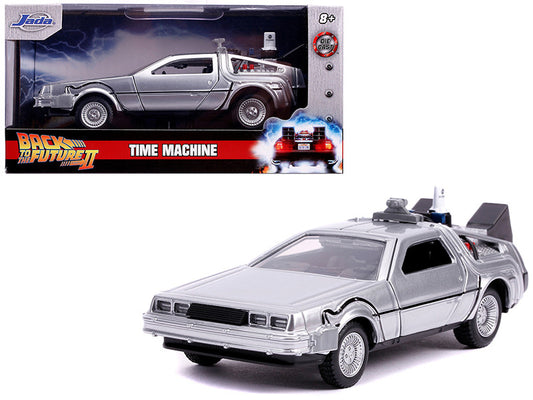 A 1/32 scale diecast model of the DeLorean DMC 'Time Machine' from the movie 'Back To The Future 2'. The model is silver, has real rubber tires, and features opening doors with a detailed interior and exterior.