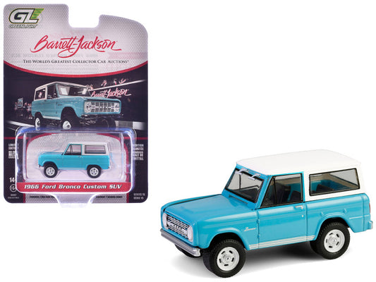 1966 Ford Bronco Custom SUV model car in packaging with Barrett-Jackson branding