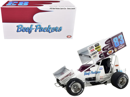 A diecast model of a Winged Sprint Car with the number 83 and 'Beef Packers' sponsorship logo, along with the original packaging box.