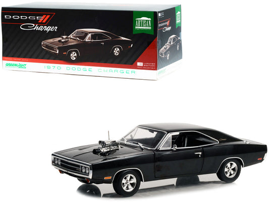 Black Dodge Charger model car with packaging in the background