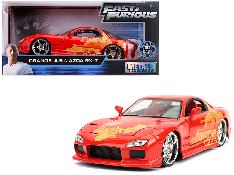 Red model car with yellow graphics in front of its packaging, featuring 'Fast & Furious' branding.