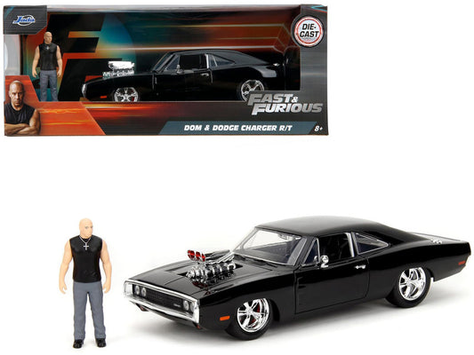 Black Dodge Charger R/T model car from 'Fast & Furious' with a figure and packaging.