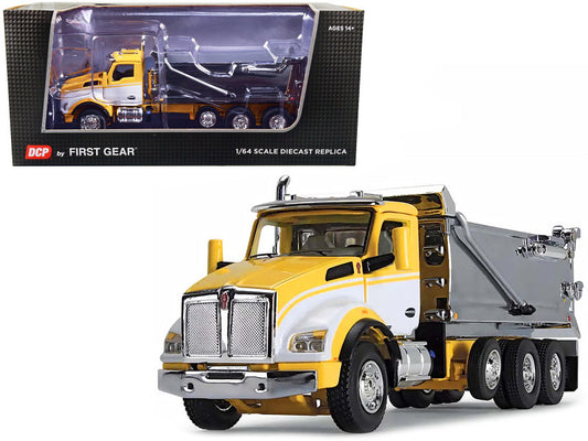 A 1/64 scale diecast model of a Kenworth T880 Day Cab with a Rogue Transfer Dump Body in yellow, white, and chrome colors, made by First Gear.