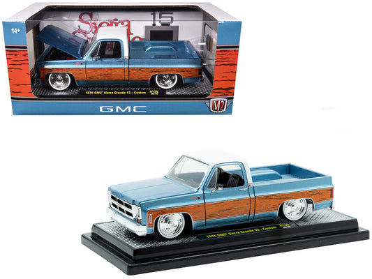 Model GMC truck in a display box with 'M2 Machines' branding.