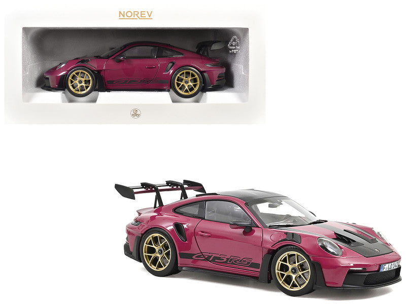 Pink sports car model with gold wheels on a white background