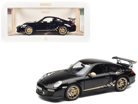 Black sports car model with gold accents on a white background, featuring the Norev brand.
